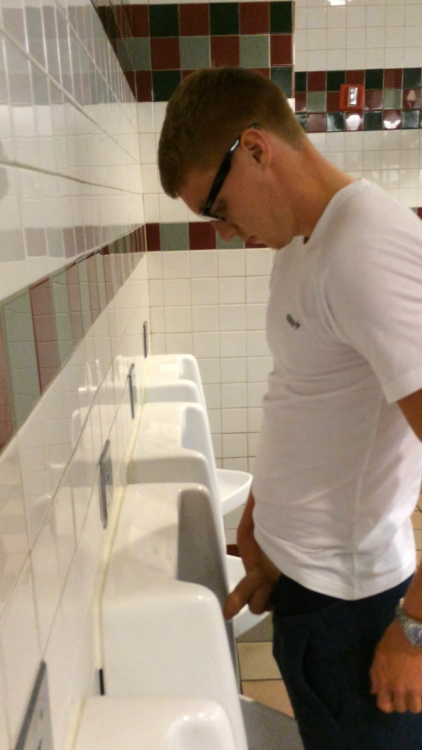 Guys pissing urinal